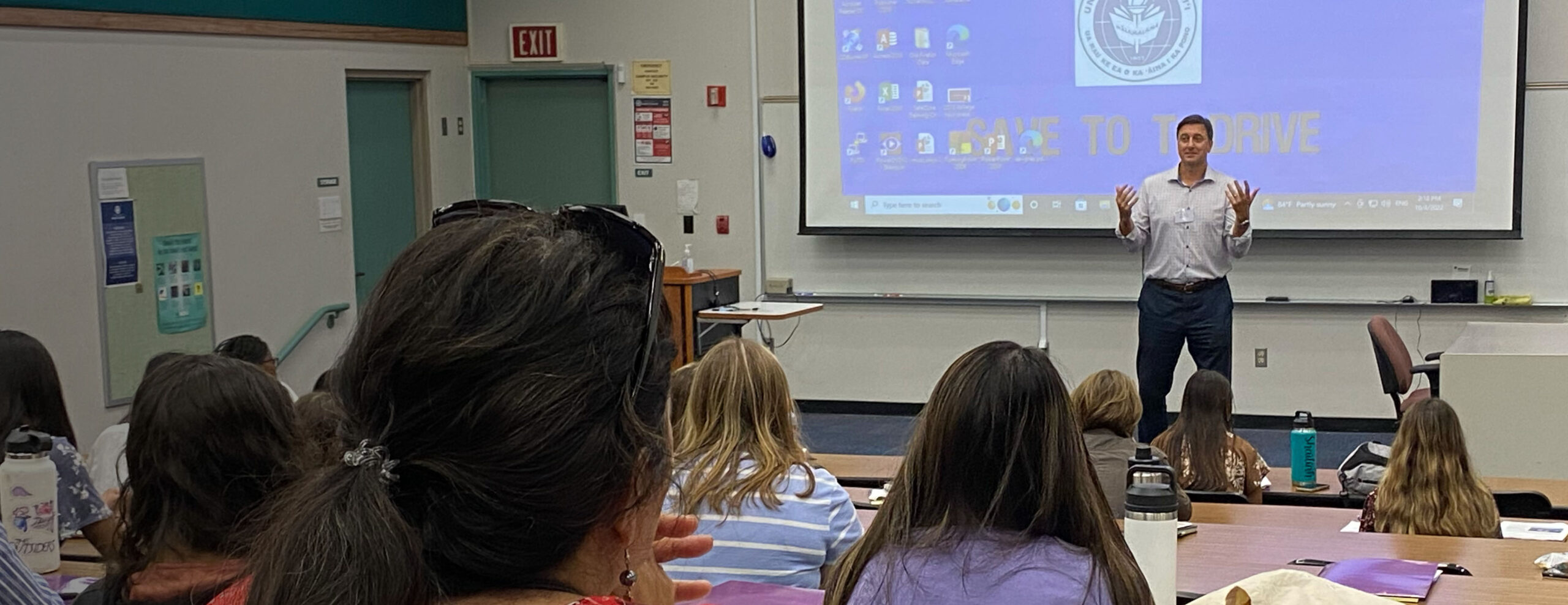 Instructor leading a Law & Justice Academy session on courtroom argument at a University of Hawaiʻi campus
