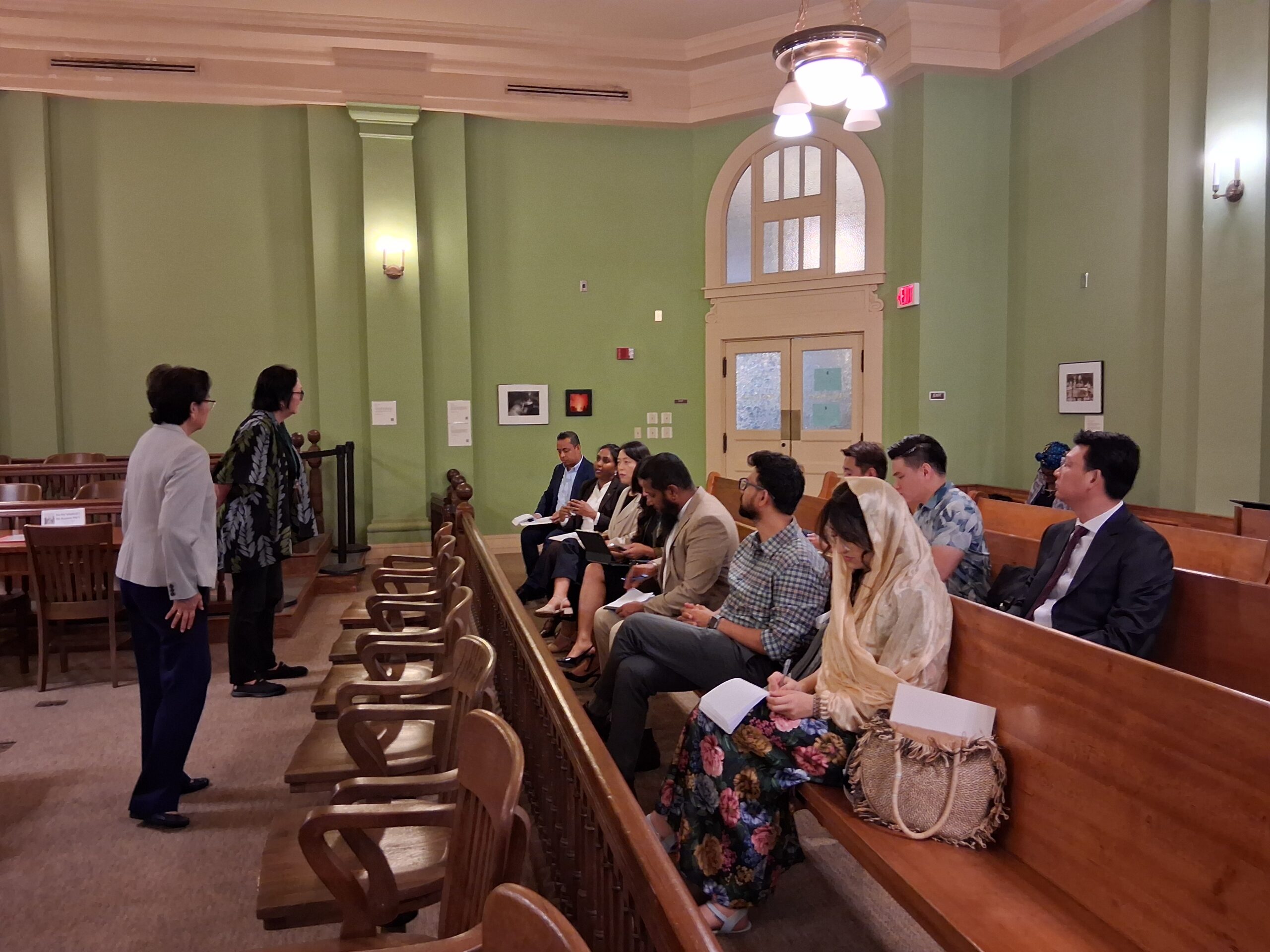 Delegates taking notes during the courtroom discussion at Aliʻiōlani Hale