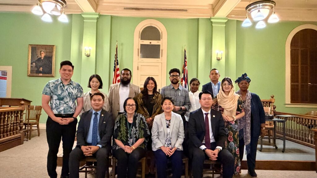 Delegates and program liaison are pictured with Justices Sabrina S. McKenna and Lisa M. Ginoza