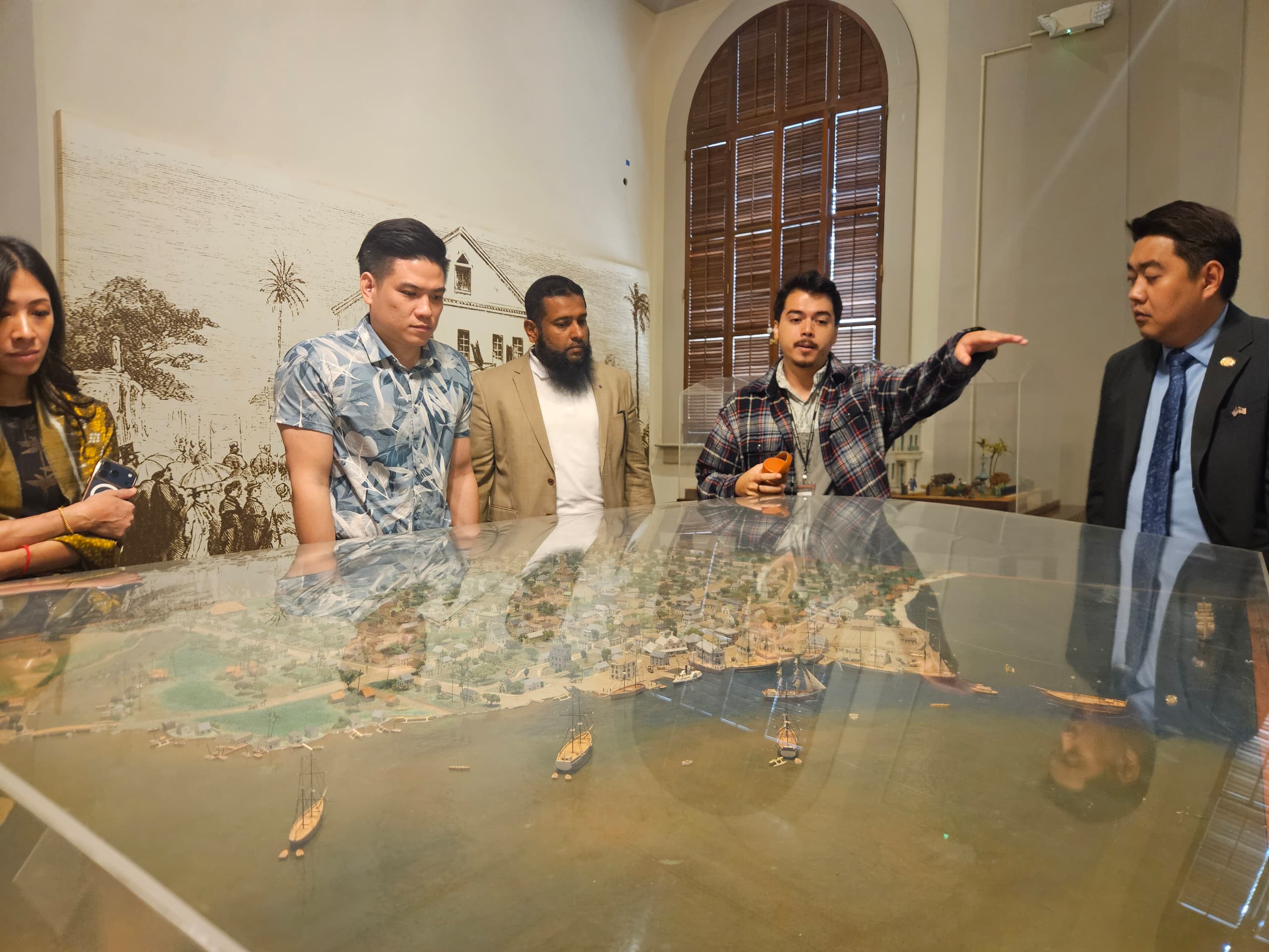 Manaʻo Dela Cruz leads the delegation through the King Kamehameha V Judiciary History Center